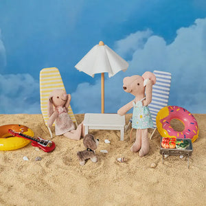 Mouse figurine Pip listening to a seashell in a 1:12 scale seaside story-box.