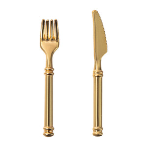 White background image of miniature cutlery including a fork and knife for a 1:12 scale dollhouse table setting