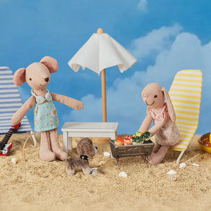 A warm beach scene celebrating friendship and imagination with the Kivvi Tales collection.