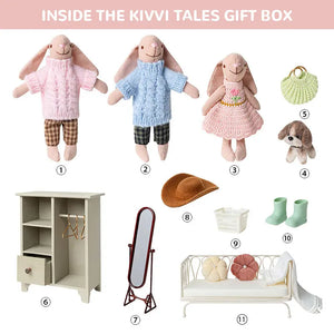 Complete contents of the miniature dressing room set including bunny figurines, wooden wardrobe, metal daybed, and accessories.