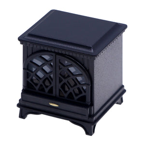 Miniature fireplace in black with classic arched doors, a cozy 1:12 scale accent for dollhouse rooms