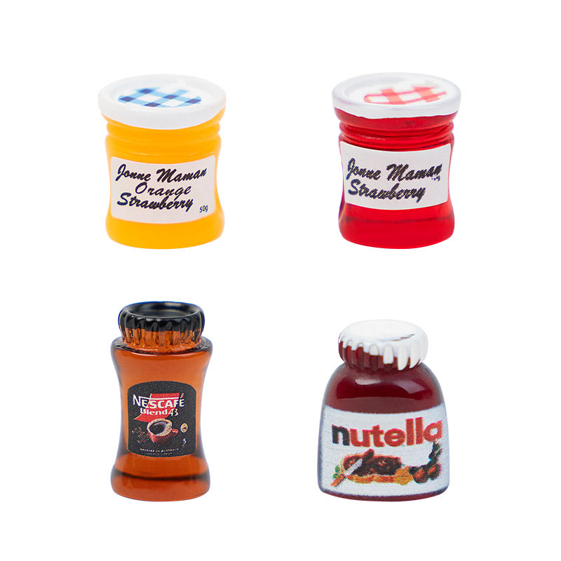 Miniature Food Jars set with vibrant orange jam, strawberry jam, Nutella, and instant coffee, perfect for dollhouse kitchen shelves or cozy breakfast table scenes.