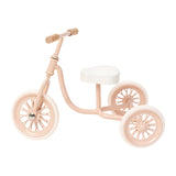 Miniature tricycle pink vintage metal ride-on, charming 1:12 scale dollhouse nursery or garden accessory with moving wheels