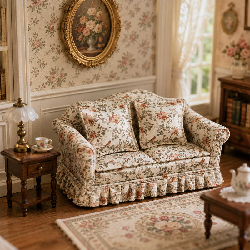 Vintage floral miniature sofa paired with a wood side table, lamp and tea cup in a classic living room