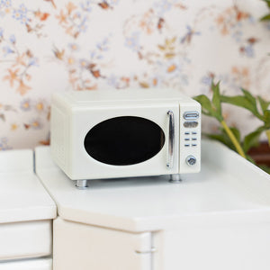 Miniature microwave oven styled on kitchen counter, warm dollhouse appliance decor for pantry shelves or breakfast nook scenes