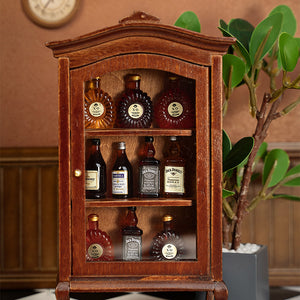 Vintage walnut liquor cabinet close-up with miniature bottles, warm dollhouse dining room accent beside plants, cozy handcrafted 1:12 scene