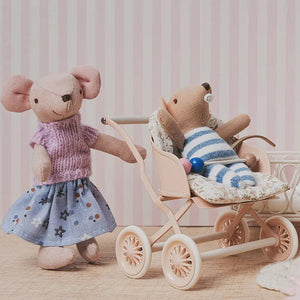 cozy nursery setup designed for storytelling and baby care role play in a dollhouse scene.