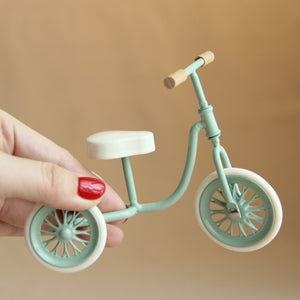 Dollhouse nursery accessory green metal tricycle in hand, realistic 1:12 scale movable wheels for cozy room scenes