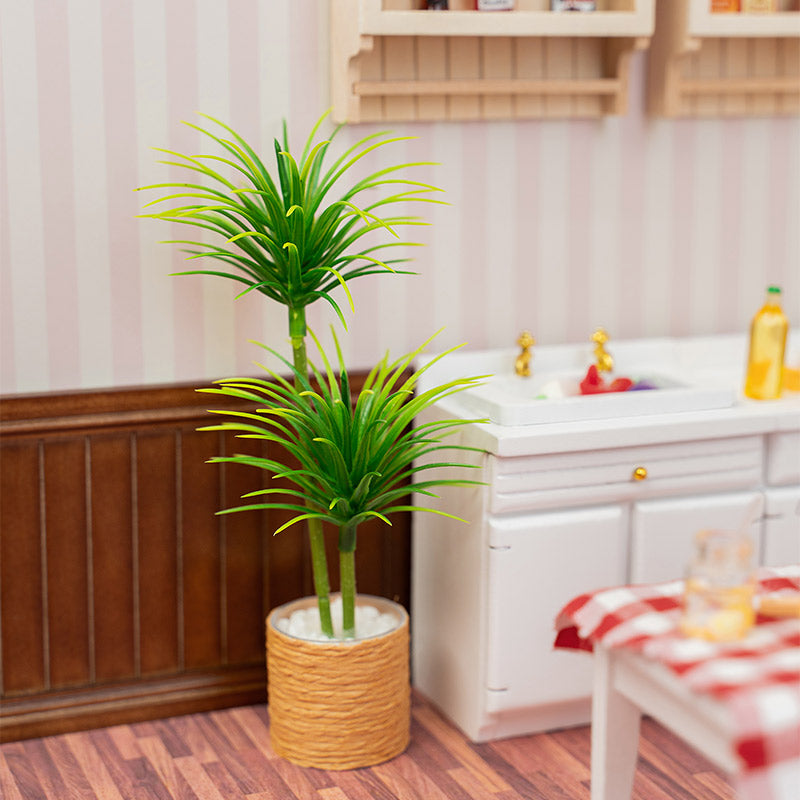 Miniature Dracaena potted tree in 1:12 scale dollhouse kitchen, tall lush foliage creating natural warmth and playful botanical accent