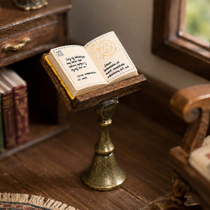 Miniature reading stand with open book styled by a window for a warm vintage library or study scene