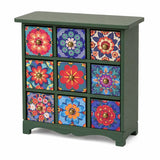 Dollhouse cabinet in deep green with colorful floral drawers, a charming accent for cozy miniature interiors