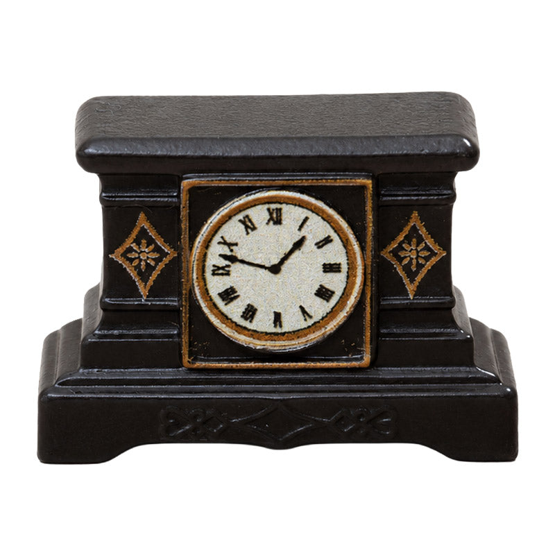 Dollhouse mantel clock in black resin with gold accents and Roman numerals for warm vintage miniature decor.