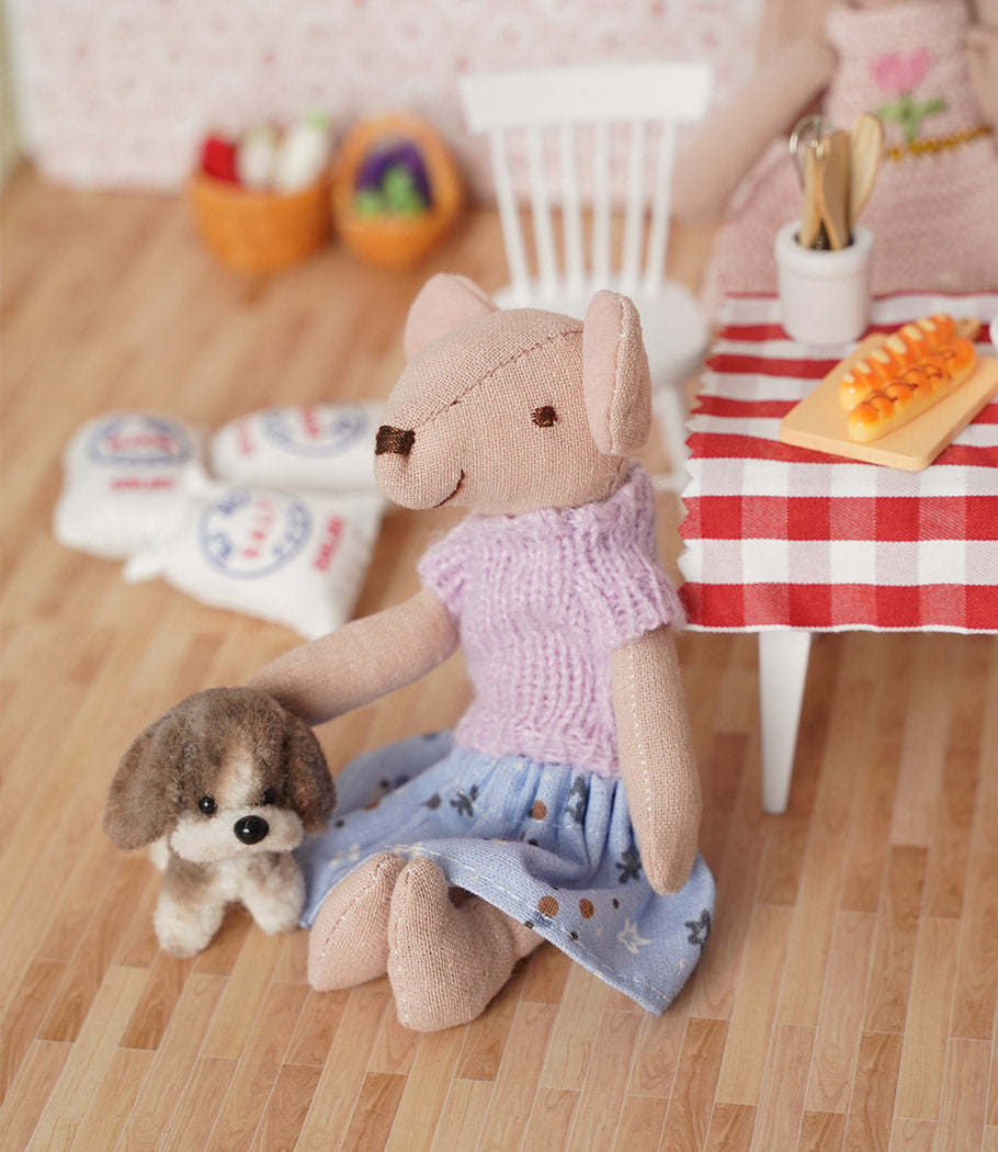 Cozy dollhouse kitchen with mouse friend, tiny puppy, dining table and fresh bread in a warm family story scene