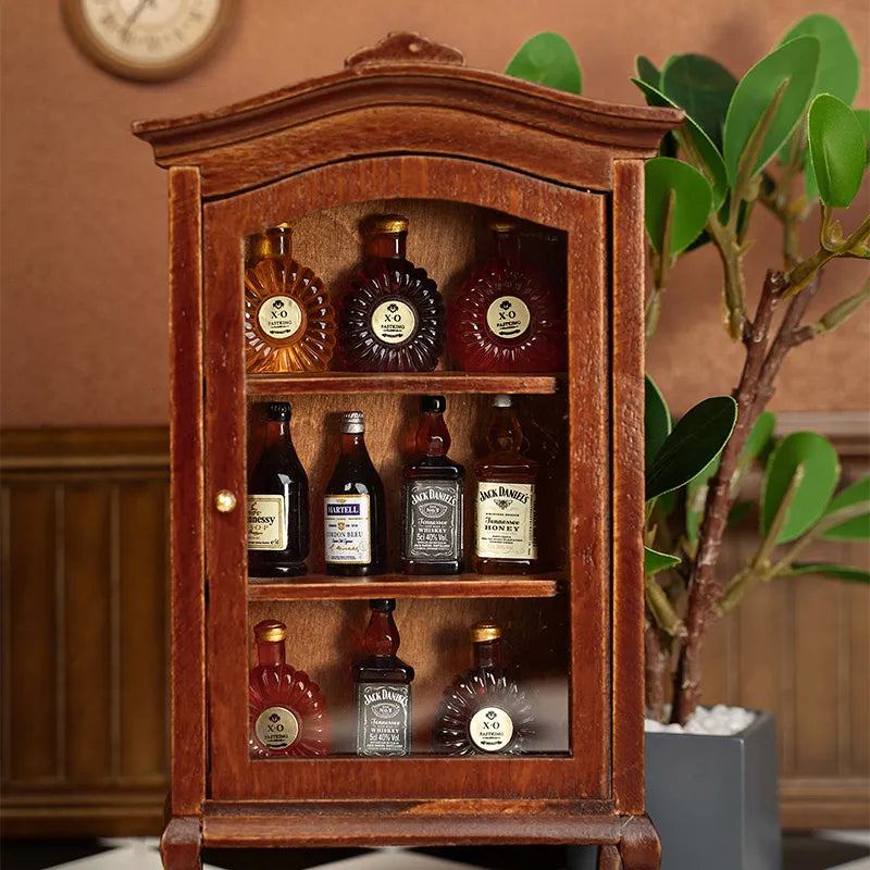Vintage walnut liquor cabinet close-up with miniature bottles, warm dollhouse dining room accent beside plants, cozy handcrafted 1:12 scene