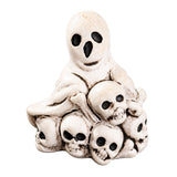 Dollhouse Halloween decorations with ghost and skull pile resin figurine for a playful spooky miniature scene.