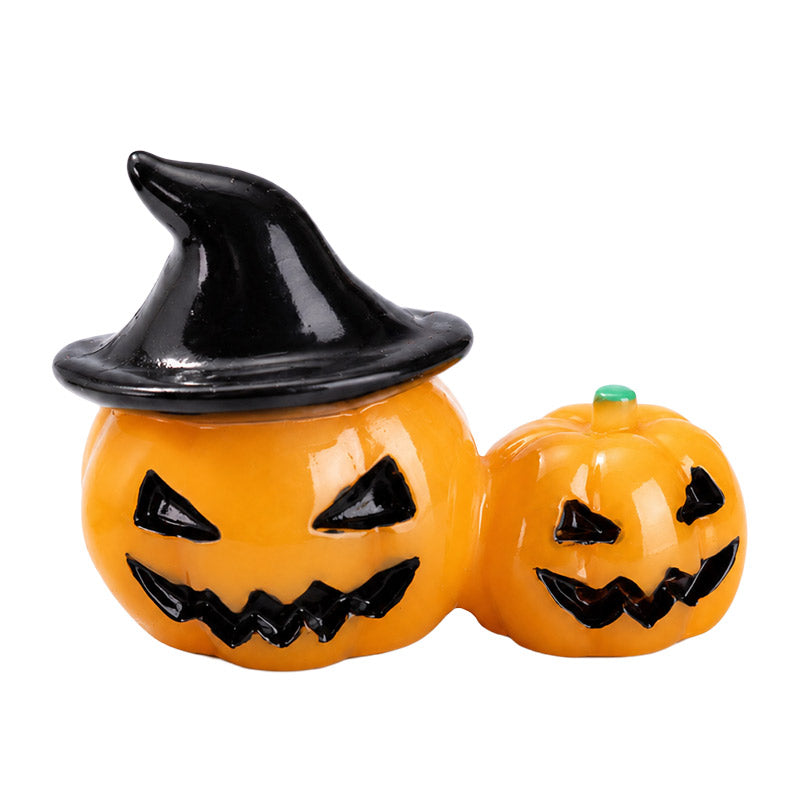 Dollhouse Halloween decorations with double jack-o'-lantern pumpkins for a warm and playful miniature porch scene.