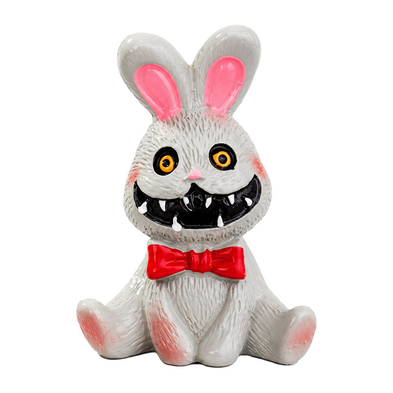 Dollhouse Halloween decorations featuring a creepy bunny figurine with storybook charm for a whimsical spooky room.