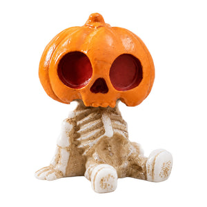 Dollhouse Halloween decorations with a pumpkin skeleton figurine for a playful haunted room or autumn display.