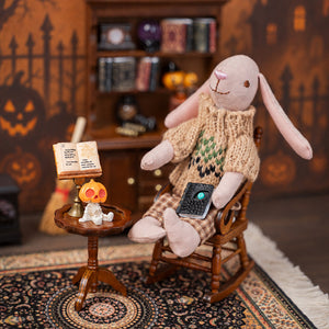 Bunny figure reads beside a brass lectern and spell book in a warm vintage Halloween study setting