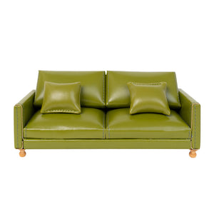 Dollhouse Leather Sofa in olive green PU with two matching cushions, bringing cozy vintage charm to a 1:12 living room