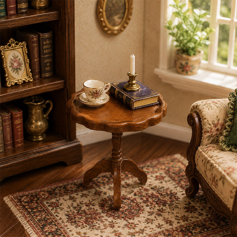 Brown wooden pedestal table with teacup, books and candle for a warm miniature reading corner by the window