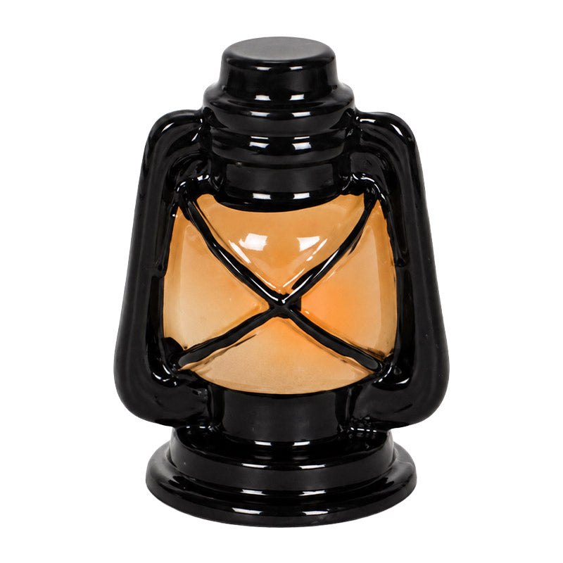 Dollhouse oil lamp in caged resin style with a warm amber center, bringing vintage charm to tiny room displays.