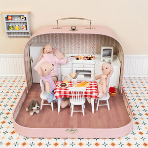 Miniature dollhouse room box styled as a warm kitchen scene with tiny furniture for Kivvi Town stories
