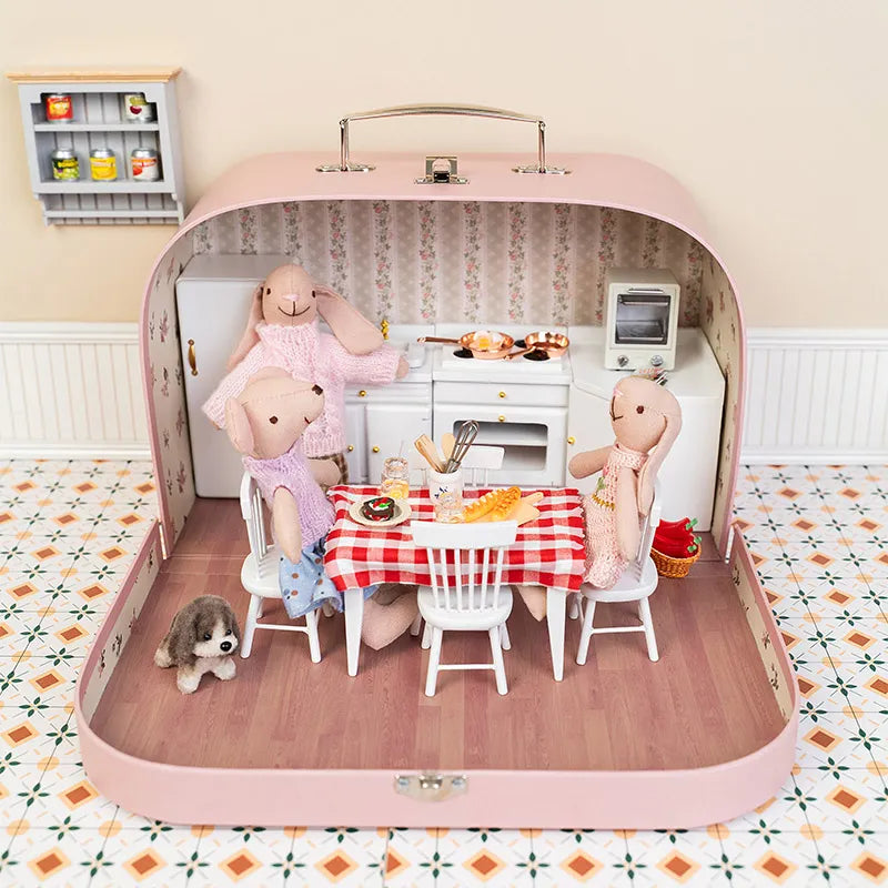 Miniature dollhouse room box styled as a warm kitchen scene with tiny furniture for Kivvi Town stories