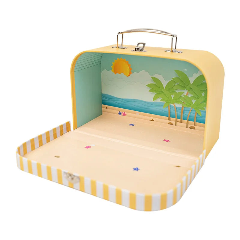 Portable dollhouse suitcase with beach-inspired interior, adding playful 1:12 scale scenery to tiny story worlds