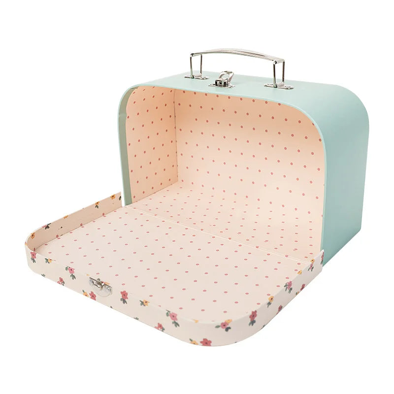 Portable dollhouse carry case in soft blue design, creating a cozy miniature room for imaginative play and display