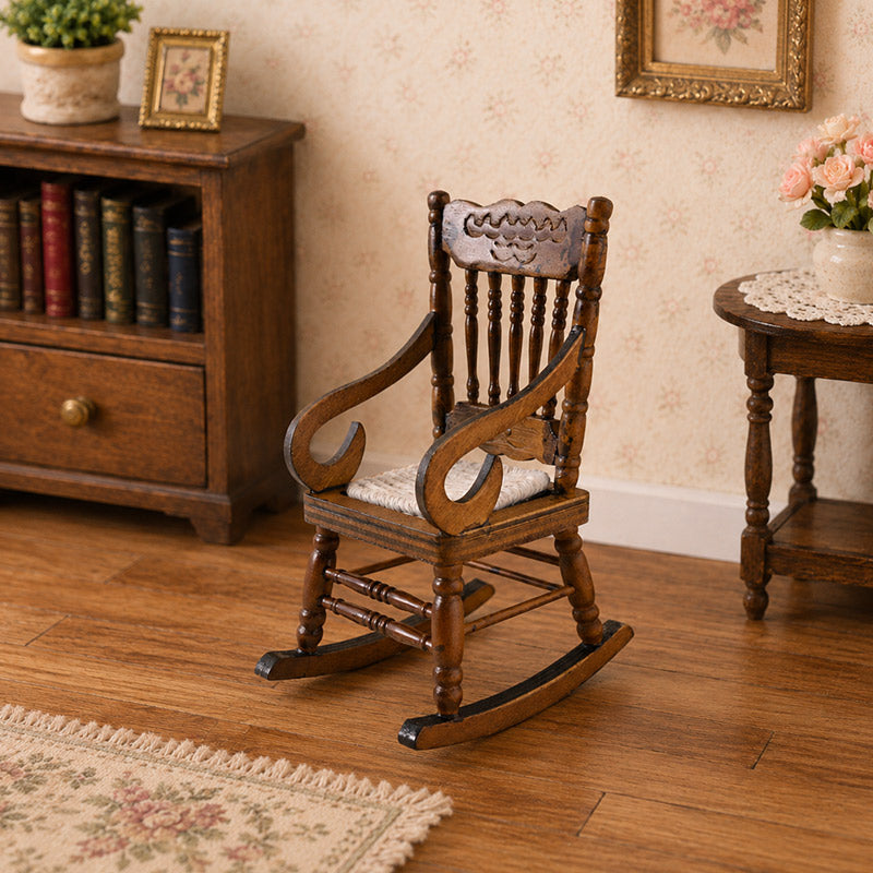 Vintage miniature rocking chair paired with a bookcase and side table in a warm classic living room corner
