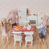 Miniature kitchen scene with mouse, bunny and bunny mom, featuring dining table, cabinets and baking setup in a cozy 1:12 dollhouse home