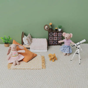 Dollhouse bedroom set with Milo and Pip, featuring a mini bed, telescope, and bohemian decor.