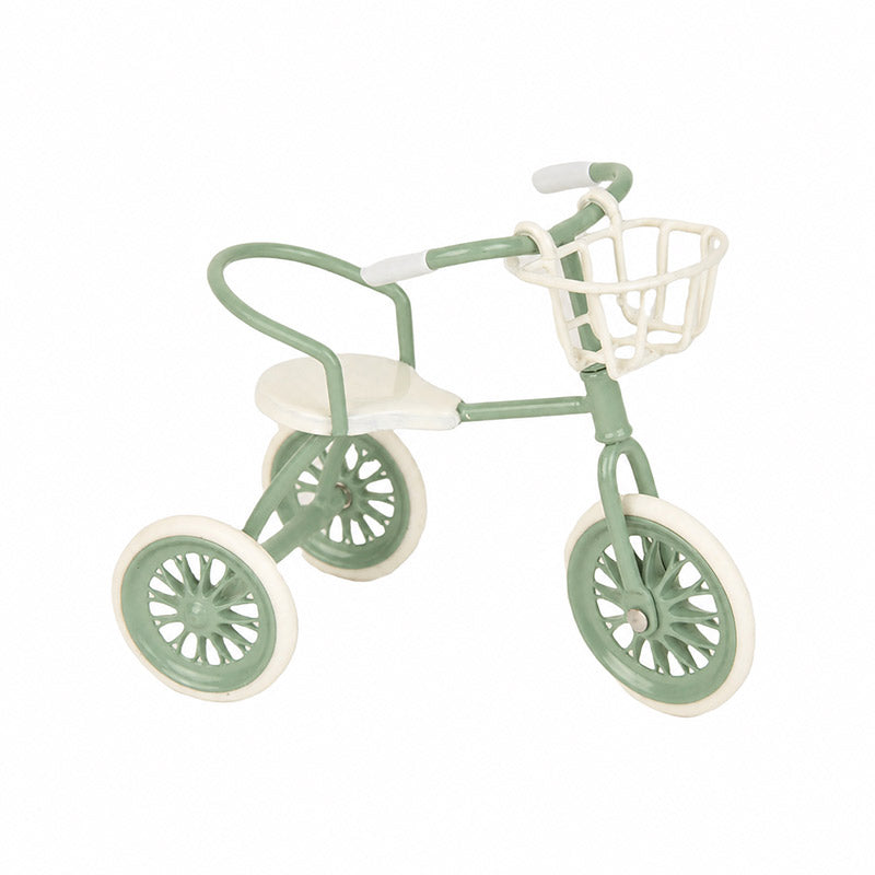 Green dollhouse tricycle with basket, a charming miniature accent for gardens, picnics and sunny outdoor stories