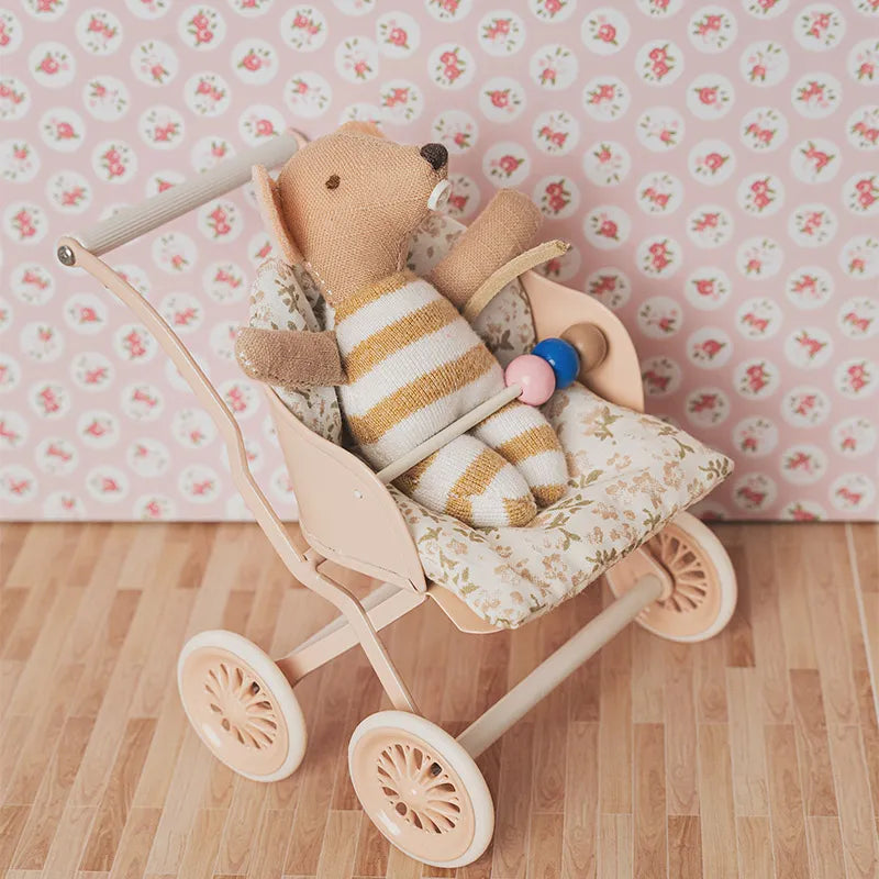 Miniature mouse baby in yellow romper, placed in a 1:12 scale stroller with soft floral bedding for cozy dollhouse scenes.
