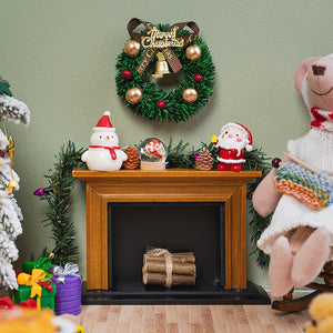 Decorative Christmas garland draped around a miniature fireplace, adding cheerful holiday colors to a cozy living room.