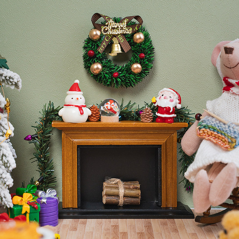 Decorative Christmas garland draped around a miniature fireplace, adding cheerful holiday colors to a cozy living room.