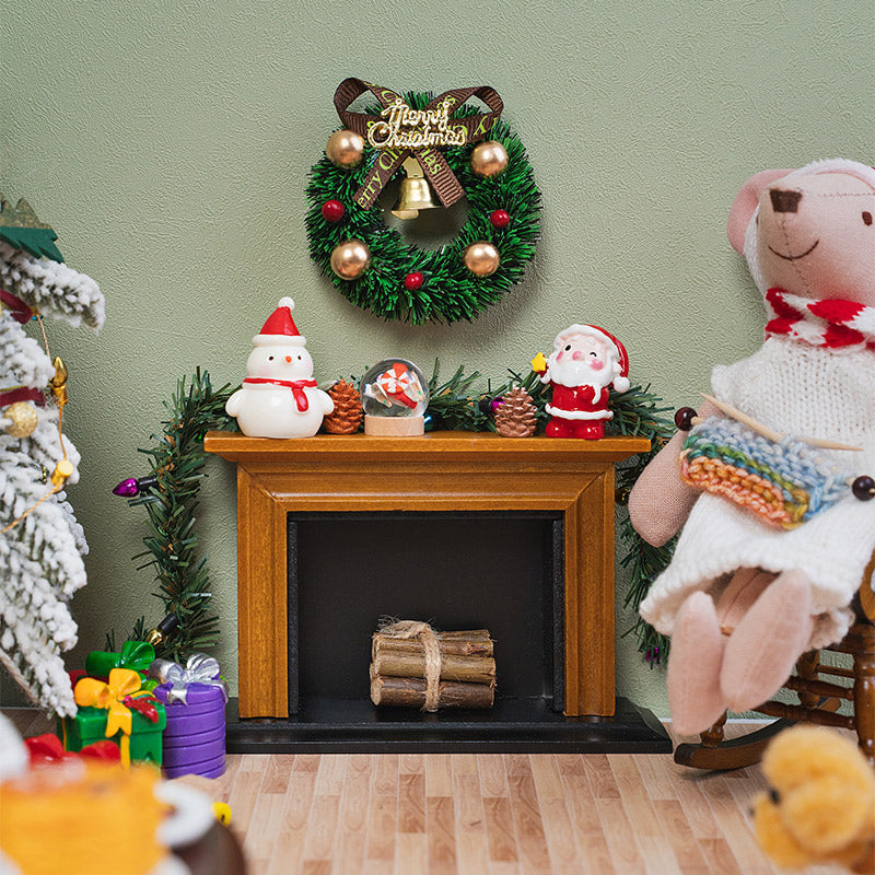 Tiny Christmas candy globe displayed on a wooden fireplace mantel with Santa and a snowman for a cozy holiday scene