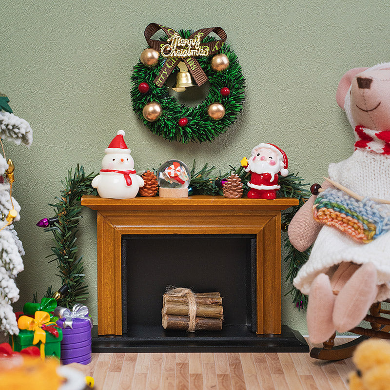 Vintage wooden hearth styled with Christmas garlands, tiny gifts and festive figures for a warm holiday dollhouse living room